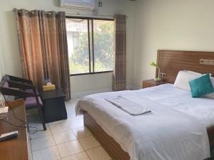 Ένα ή περισσότερα κρεβάτια σε δωμάτιο στο Hotel River View