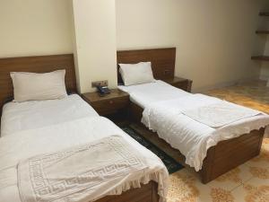 Ένα ή περισσότερα κρεβάτια σε δωμάτιο στο Hotel River View