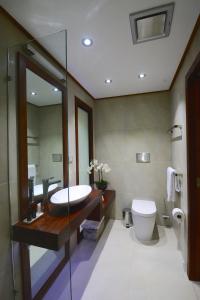 a bathroom with a sink and a toilet at Black Palm Cape Tribulation in Cape Tribulation