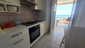 Cucina o angolo cottura di 058 Spiaggia di SalentoInVacanza.Com