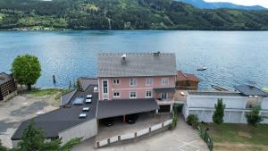 an aerial view of a house next to a lake at Seewohnung Zentral in Millstatt
