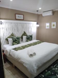 Nkanhi Centro de Conferências e Hotel 객실 침대