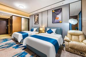 Ein Bett oder Betten in einem Zimmer der Unterkunft QingMan Apartment Guangzhou Zhujiang New Town East Railway Station Branch