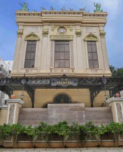 a building with a sign on the front of it at The Saibaba Hotel in Chennai