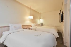 Gracias Hotel Gimhae客房内的一张或多张床位