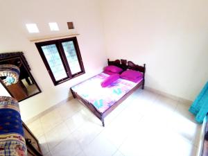 Katil atau katil-katil dalam bilik di Kotagede Street Homestay Jogja