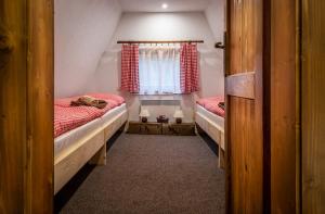 Voodi või voodid majutusasutuse Chata Smrekovica toas