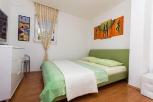 Postel nebo postele na pokoji v ubytování Apartment Mika 3