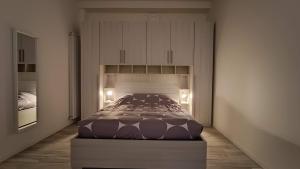 a bedroom with a large bed in a room at Savenaantico9 in Bologna