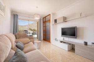 Televízia a/alebo spoločenská miestnosť v ubytovaní Apartment Vicens Buades By SunVillas Mallorca