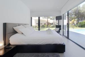 Postel nebo postele na pokoji v ubytování Villa Alfazema IV + 37 fotografií