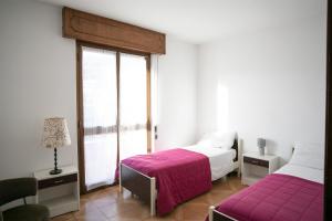 Posteľ alebo postele v izbe v ubytovaní IseoLakeRental - Appartamento Livio