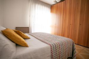 Posteľ alebo postele v izbe v ubytovaní IseoLakeRental - Appartamento Livio