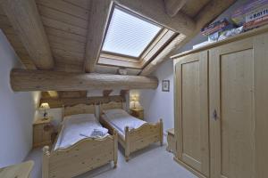 a bedroom with two bunk beds and a window at Chesa Suvretta - Celerina in Celerina