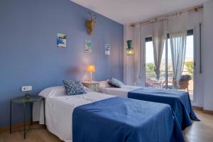 Posteľ alebo postele v izbe v ubytovaní Port Pals, precioso apartamento con vista al mar y piscina