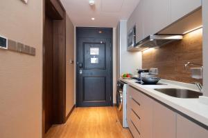 Eldhús eða eldhúskrókur á Rocase Boutique Hotel Wuxi