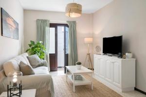 Televízia a/alebo spoločenská miestnosť v ubytovaní Apartamento La Estrella 5