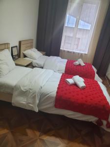 Кровать или кровати в номере DIOSKURIA BORJOMi
