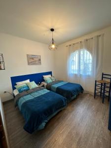 Posteľ alebo postele v izbe v ubytovaní Maison de vacances avec amarre