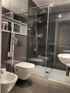 a bathroom with a shower and a toilet and a sink at Iturrain by smiling rentals in Hondarribia +18 photos