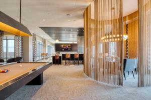 a lobby with a pool table and a bar at Bethesda 2br w wd gym pool nr dining WDC-661 in Bethesda