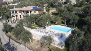 an aerial view of a house with a swimming pool at Casa Maya in Brenzone sul Garda