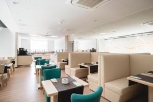 a dining room with tables and chairs at Hotel Thermal ŠÍRAVA in Kaluža +36 photos