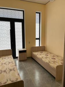 Llit o llits en una habitació de Tastaq hostel
