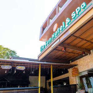 a restaurant with a sign on the front of it at The Sun Hotel & Spa Legian - CHSE Certified in Legian