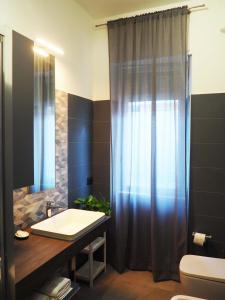 a bathroom with a sink and a shower at Picena 177 in Chieti