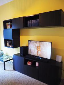 a living room with a flat screen tv on a wall at Picena 177 in Chieti