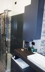 a bathroom with a shower and a sink and a counter at Picena 177 in Chieti