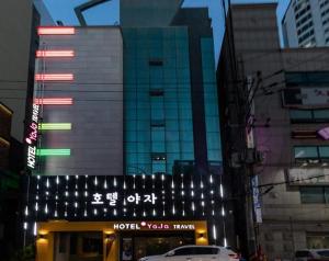 a view of a hotel with lights in a city at Hotel H2 in Ulsan