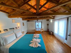 Кровать или кровати в номере Agnanti Villas 1