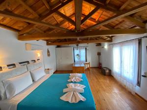 Кровать или кровати в номере Agnanti Villas 1