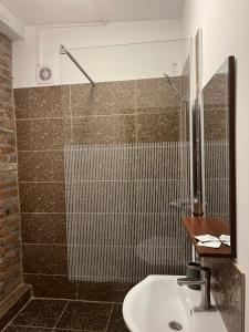 a bathroom with a shower and a sink at Sport Residence in Bacău +45 photos