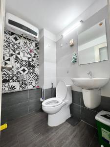a bathroom with a white toilet and a sink at Unique Studio in Japanese Town R102 -Central Saigon in Ho Chi Minh City