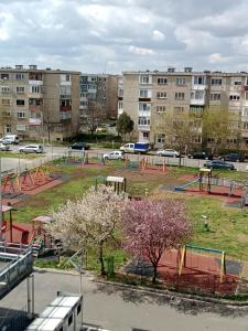 an empty park with a playground in a city at Flat 4you & WI-FI in Arad