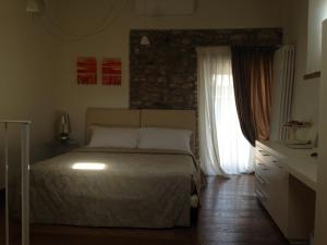 Postel nebo postele na pokoji v ubytování Oreste Suite