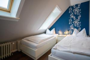 Ένα ή περισσότερα κρεβάτια σε δωμάτιο στο Haus Lauenburg Wohnung 6
