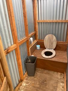 a bathroom with a toilet in a building at Granny’s Hut in Thornhill