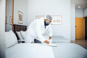 Krevet ili kreveti u jedinici u okviru objekta Hotel Terminus Maputo