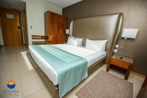 Krevet ili kreveti u jedinici u okviru objekta Hotel Terminus Maputo