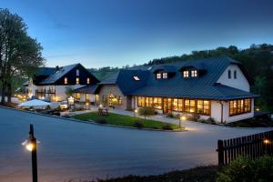 an image of a home at night with lights at Landhotel Rittersgrün in Breitenbrunn