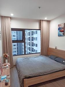 Postel nebo postele na pokoji v ubytování Green Homestay Ocean Park Gia Lâm