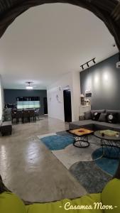 a living room with a couch and a table at Casamea MOON (Shoplot) 2 Bedroom-Free Wifi & Washer in Sibu