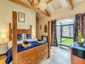 a bedroom with a bed and a large window at The Hemmel - Uk43357 in Branxton