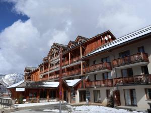 a large building with snow on the ground at Appartement Les Orres, 3 pièces, 8 personnes - FR-1-322-429 in Les Orres