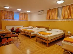Postel nebo postele na pokoji v ubytování Penzion Kovac