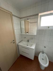Koupelna v ubytování Apartments Elvira
